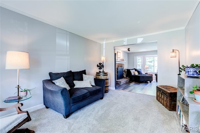 10 Forest Pine Ct, Ofallon, MO 63368 - living area with a brick fireplace, crown molding, and carpet floors