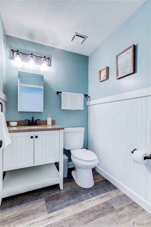 10 Forest Pine Ct, Ofallon, MO 63368 - bathroom with wood finished floors and vanity