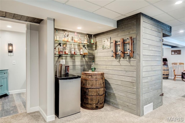 10 Forest Pine Ct, Ofallon, MO 63368 - indoor dry bar with wooden walls, carpet, and recessed lighting
