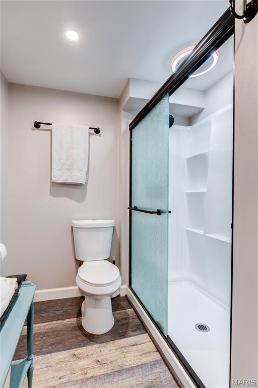 10 Forest Pine Ct, Ofallon, MO 63368 - full bathroom with wood finished floors, a stall shower, vanity, and recessed lighting
