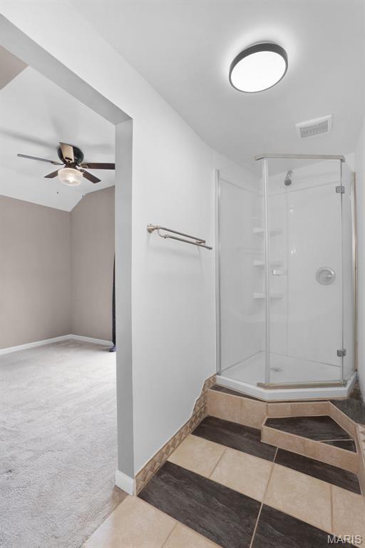 508 Prince Ruppert Dr, Ofallon, MO 63366 - bathroom with ceiling fan, a stall shower, baseboards, and tile patterned floors