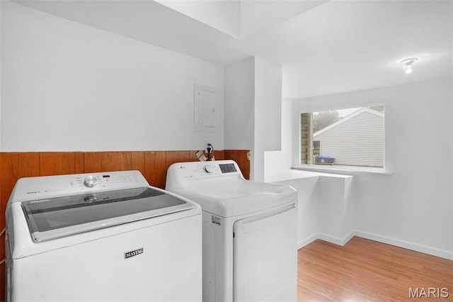 508 Prince Ruppert Dr, Ofallon, MO 63366 - laundry room featuring washer and dryer, light wood-style floors, and baseboards