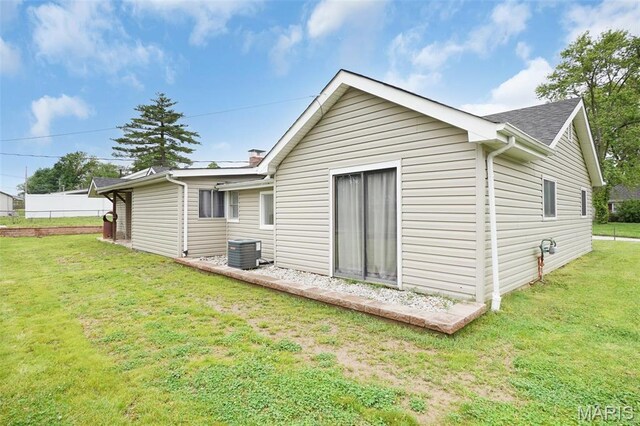 508 Prince Ruppert Dr, Ofallon, MO 63366 - back of house with central air condition unit and a yard