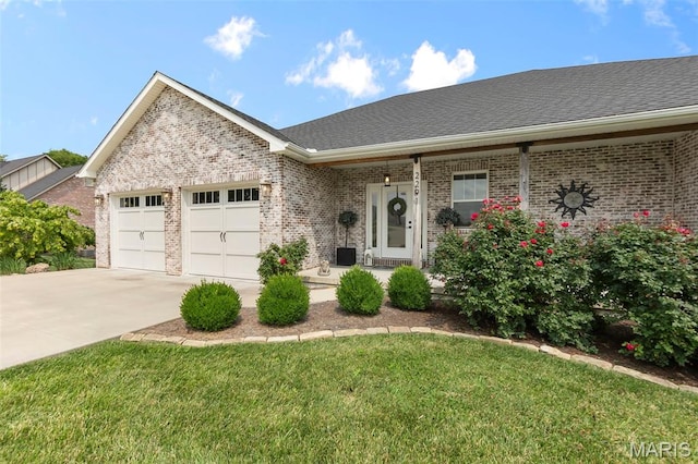 2291 Cambridge, Jackson, MO 63755 - ranch-style home featuring brick siding, concrete driveway, a garage, and a front yard