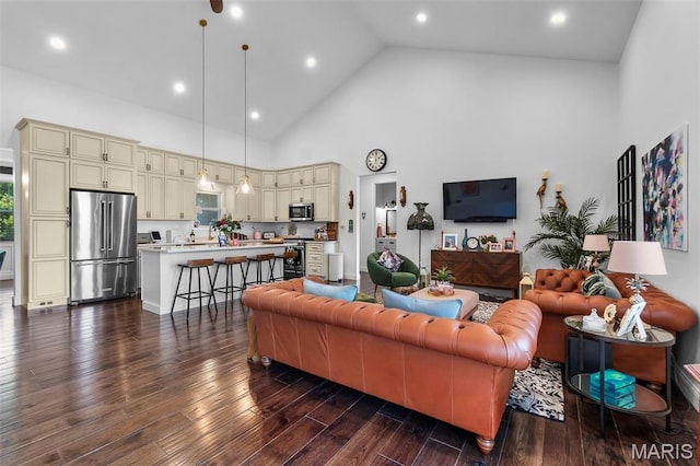 2291 Cambridge, Jackson, MO 63755 - living room with high vaulted ceiling, dark wood finished floors, and recessed lighting