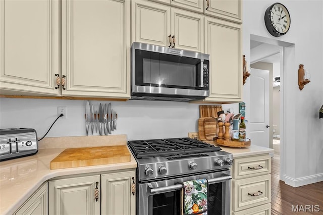 2291 Cambridge, Jackson, MO 63755 - kitchen featuring appliances with stainless steel finishes, cream cabinetry, and light countertops