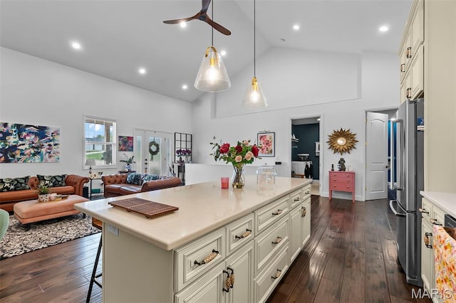 2291 Cambridge, Jackson, MO 63755 - kitchen with freestanding refrigerator, high vaulted ceiling, light countertops, a kitchen bar, and ceiling fan