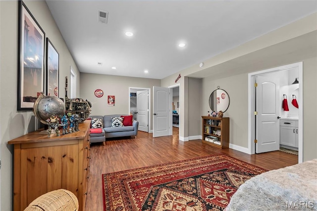 2291 Cambridge, Jackson, MO 63755 - living room featuring wood finished floors, baseboards, and recessed lighting