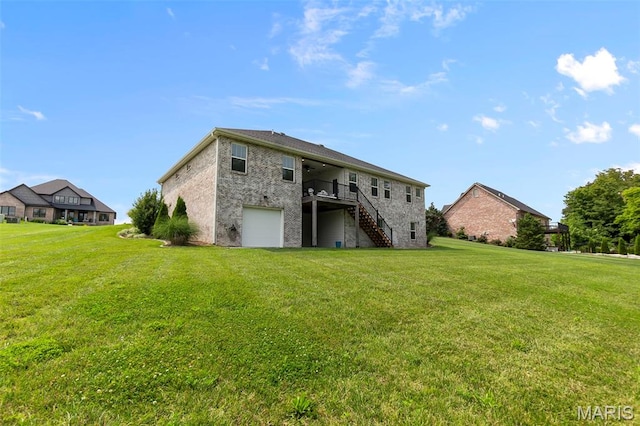 2291 Cambridge, Jackson, MO 63755 - back of property featuring stairway, a wooden deck, a lawn, a garage, and brick siding