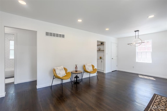 702 Crompton Ct, Saint Louis, MO 63126 - sitting room with healthy amount of natural light, a chandelier, dark wood-style floors, and recessed lighting