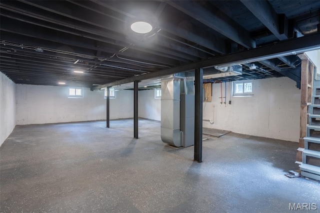 702 Crompton Ct, Saint Louis, MO 63126 - basement featuring heating unit and plenty of natural light
