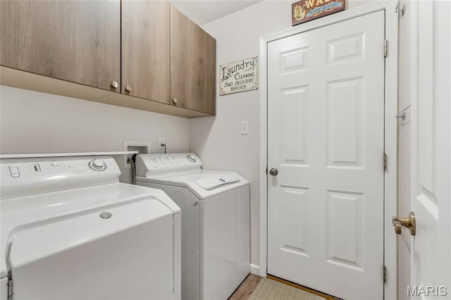 220 Preserve Park Pl, Wentzville, MO 63385 - laundry room featuring cabinet space, independent washer and dryer, and light wood-style flooring