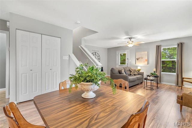 220 Preserve Park Pl, Wentzville, MO 63385 - dining area featuring ceiling fan, light wood-type flooring, stairs, and healthy amount of natural light