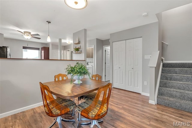 220 Preserve Park Pl, Wentzville, MO 63385 - dining space featuring stairway, a ceiling fan, and wood finished floors