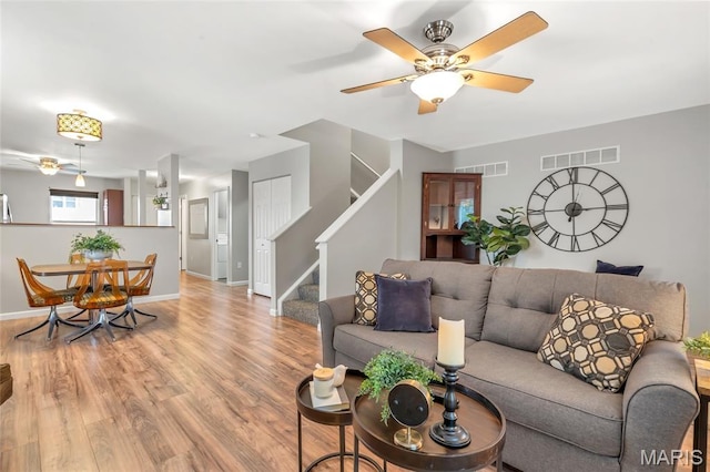 220 Preserve Park Pl, Wentzville, MO 63385 - living area featuring stairs, ceiling fan, and wood finished floors