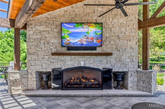 5425 Independence Rd, Weldon Spring, MO 63304 - detailed view of an outdoor stone fireplace, ceiling fan, and stone siding