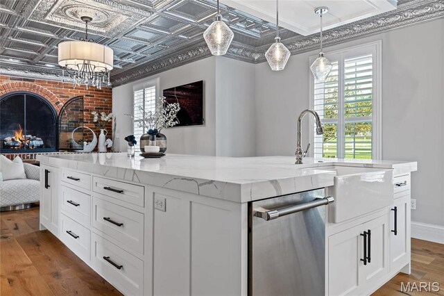 5425 Independence Rd, Weldon Spring, MO 63304 - kitchen featuring dishwasher, a sink, open floor plan, an ornate ceiling, and an island with sink