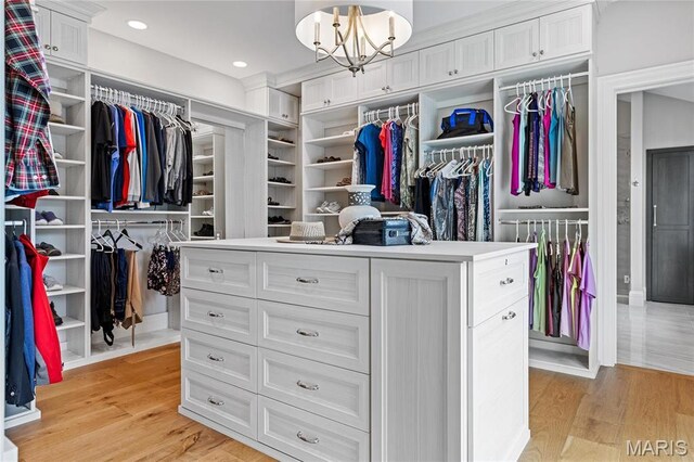 5425 Independence Rd, Weldon Spring, MO 63304 - spacious closet with light wood finished floors and a chandelier