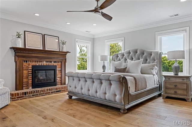 5425 Independence Rd, Weldon Spring, MO 63304 - bedroom featuring wood-type flooring, a fireplace, recessed lighting, crown molding, and a ceiling fan