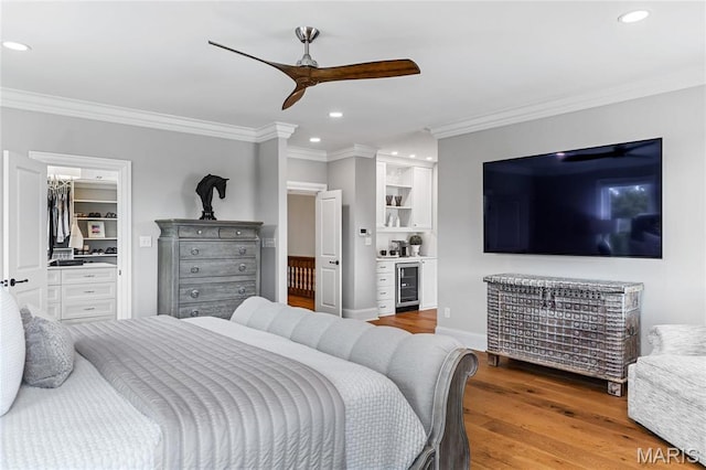 5425 Independence Rd, Weldon Spring, MO 63304 - bedroom with ornamental molding, wood finished floors, recessed lighting, wine cooler, and ceiling fan
