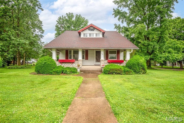 148 N Nebraska St, Marine, IL 62061 - view of front of house with a porch, a front yard, and a shingled roof