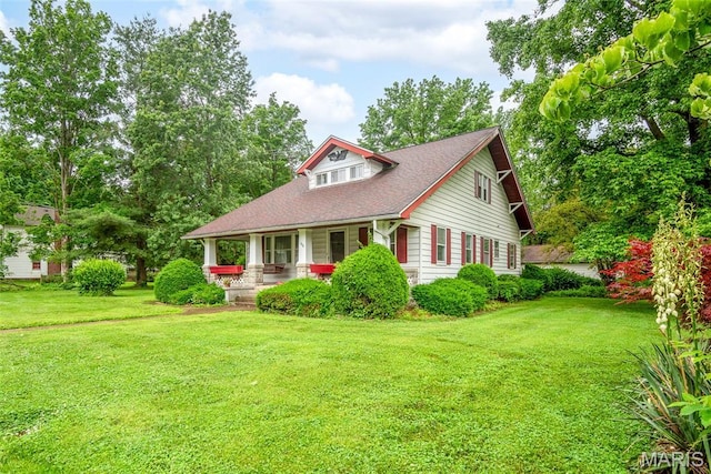 148 N Nebraska St, Marine, IL 62061 - view of front of property with a porch, a front lawn, and roof with shingles
