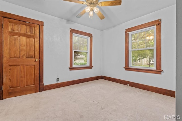 148 N Nebraska St, Marine, IL 62061 - unfurnished room featuring healthy amount of natural light, carpet flooring, baseboards, and a ceiling fan