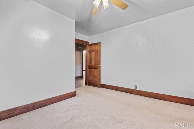 148 N Nebraska St, Marine, IL 62061 - carpeted spare room with baseboards and a ceiling fan