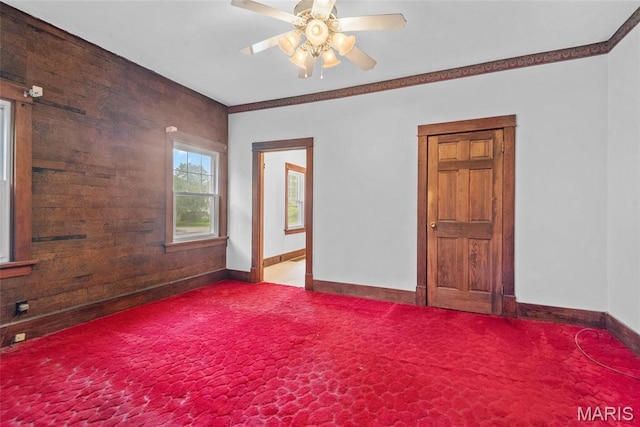 148 N Nebraska St, Marine, IL 62061 - carpeted empty room with baseboards, a ceiling fan, and wooden walls