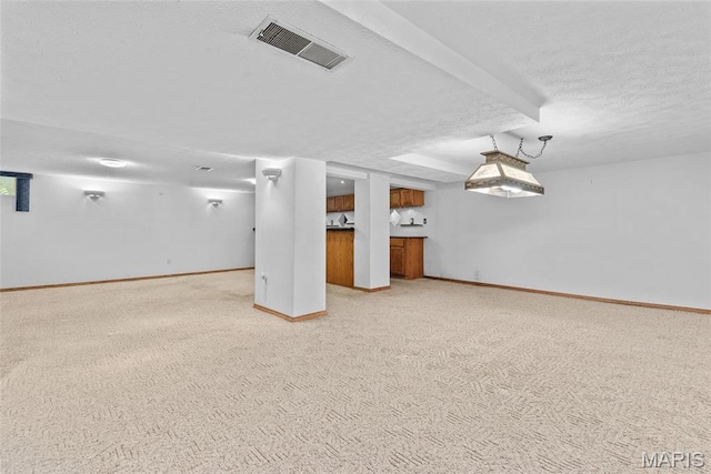 148 N Nebraska St, Marine, IL 62061 - finished basement with a textured ceiling, light carpet, and baseboards