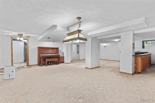 148 N Nebraska St, Marine, IL 62061 - living room featuring a textured ceiling, baseboards, light carpet, and a ceiling fan