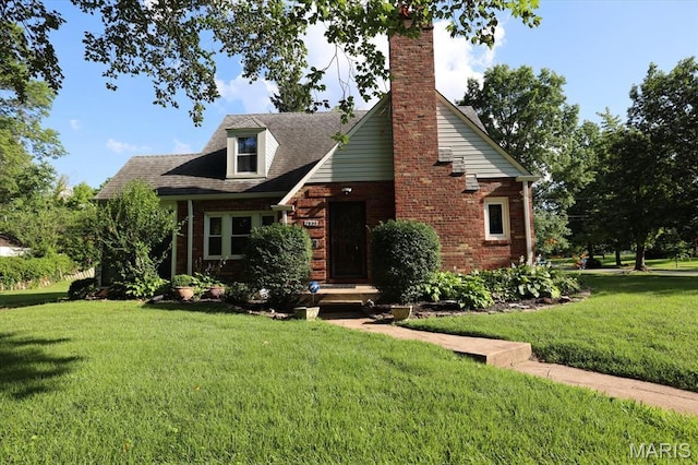 7530 Forest View Dr, Pasadena Park, MO 63121 - view of front of house with brick siding, a front lawn, and a chimney