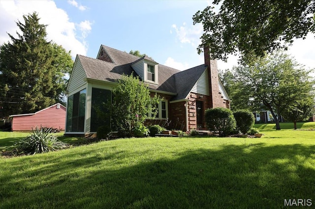 7530 Forest View Dr, Pasadena Park, MO 63121 - view of front of house with a front lawn, a chimney, and brick siding