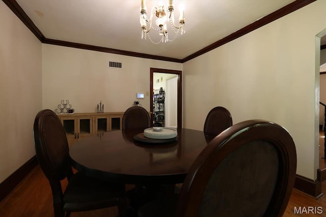 7530 Forest View Dr, Pasadena Park, MO 63121 - dining area with wood finished floors, a chandelier, and crown molding