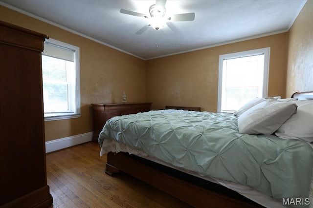 7530 Forest View Dr, Pasadena Park, MO 63121 - bedroom with wood finished floors, ornamental molding, baseboard heating, and a ceiling fan