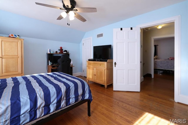 7530 Forest View Dr, Pasadena Park, MO 63121 - bedroom featuring lofted ceiling, wood finished floors, and ceiling fan