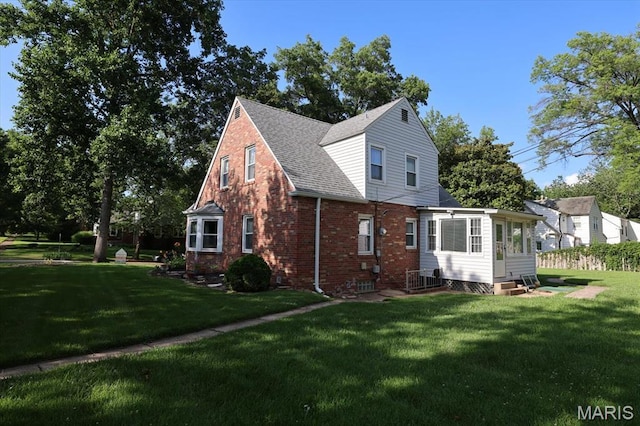 7530 Forest View Dr, Pasadena Park, MO 63121 - view of side of property featuring entry steps, brick siding, a lawn, and roof with shingles