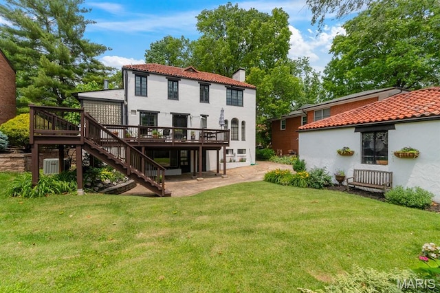 7428 Wellington Way, Clayton, MO 63105 - back of house featuring a wooden deck, stairs, a chimney, a lawn, and a patio area