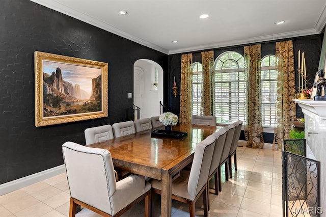 7428 Wellington Way, Clayton, MO 63105 - dining room featuring ornamental molding, arched walkways, baseboards, light tile patterned floors, and recessed lighting