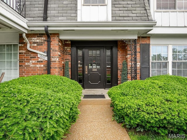 1667 Blue Ridge E, Saint Louis, MO 63125 - property entrance with brick siding, mansard roof, and a shingled roof