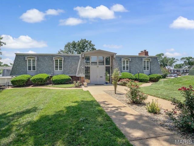 1667 Blue Ridge E, Saint Louis, MO 63125 - view of property with a front yard, mansard roof, a chimney, and brick siding