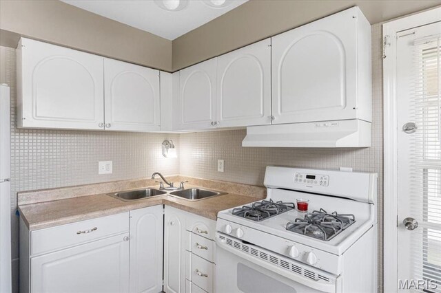 3159 Carefree Ln Unit B, Florissant, MO 63033 - kitchen featuring gas range gas stove, exhaust hood, and white cabinets