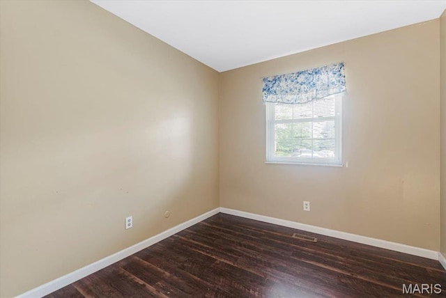 3159 Carefree Ln Unit B, Florissant, MO 63033 - empty room with baseboards and dark wood-style flooring