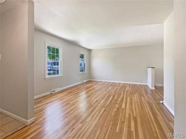 313 Pralle Ln, Saint Charles, MO 63303 - spare room featuring light wood finished floors and baseboards