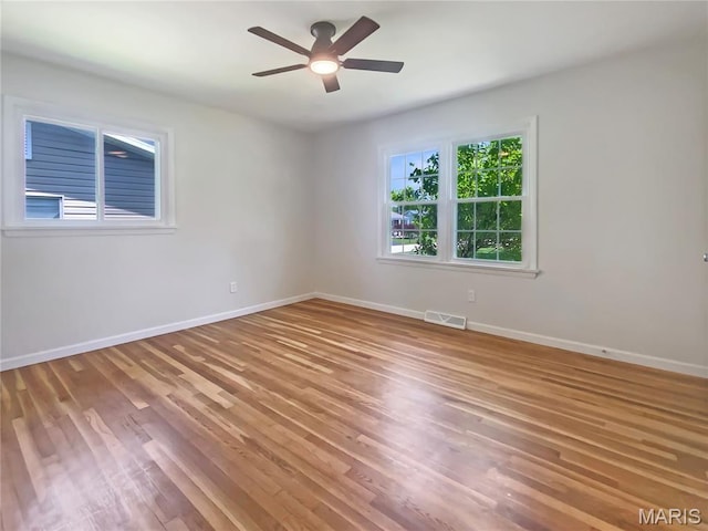 313 Pralle Ln, Saint Charles, MO 63303 - empty room with light wood-style floors, baseboards, and a ceiling fan