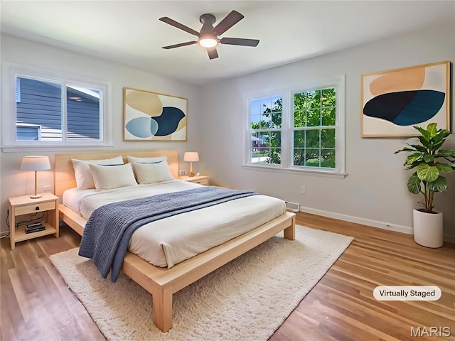 313 Pralle Ln, Saint Charles, MO 63303 - bedroom with wood finished floors, baseboards, and ceiling fan