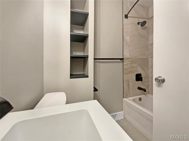 313 Pralle Ln, Saint Charles, MO 63303 - bathroom featuring bathing tub / shower combination and toilet