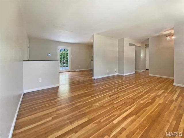 313 Pralle Ln, Saint Charles, MO 63303 - spare room with light wood-style flooring and baseboards