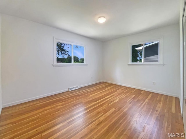 313 Pralle Ln, Saint Charles, MO 63303 - spare room featuring light wood-style flooring and baseboards