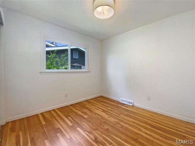 313 Pralle Ln, Saint Charles, MO 63303 - empty room with light wood-type flooring and baseboards